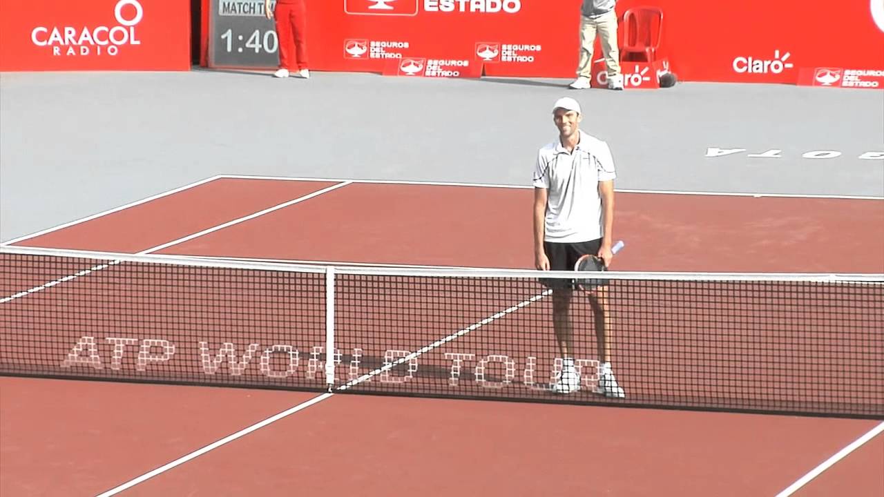 Hilarious Sela hugs Karlovic standing on a chair