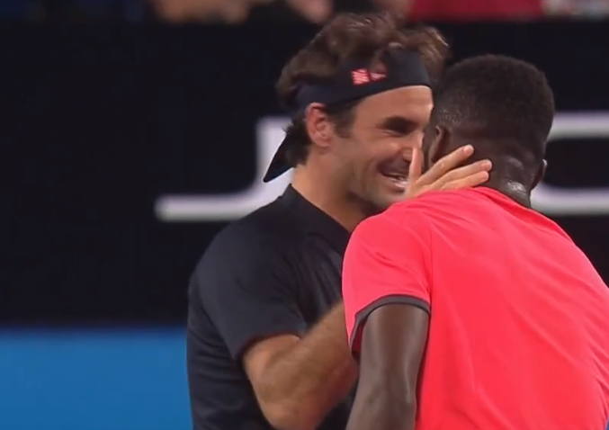 Federer laughing with Tiafoe