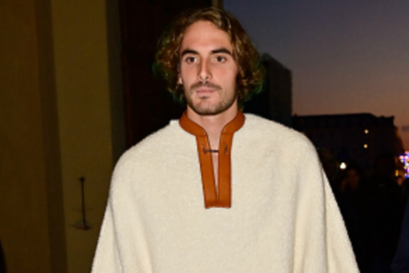 Stefanos Tsitsipas strolls the Blue Carpet in Turin, sporting a casual Poncho look