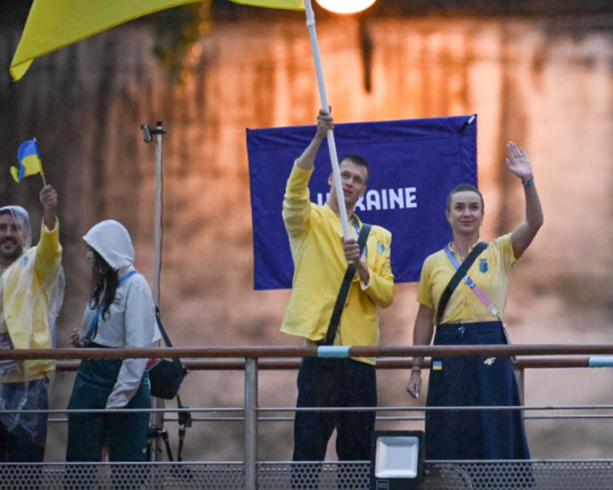 Svitolina reacts after being the Ukraine flag bearer Svitolina Raises Flag