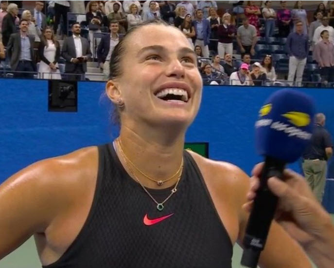 Sabalenka offers drinks to the crowd after her win over Navarro at the US Open