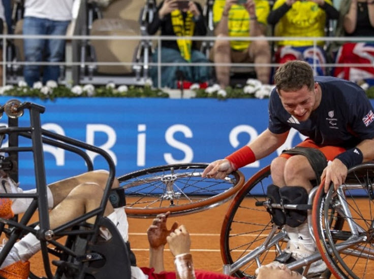 Japanese tennis player Tokito Oda falls off his wheelchair after winning gold at Paralympic