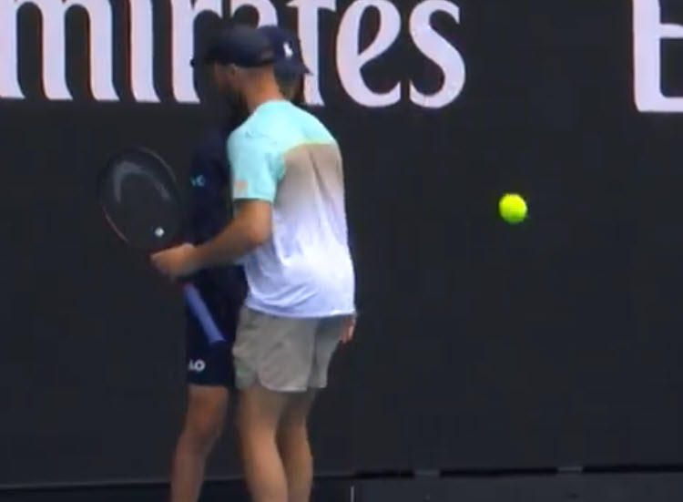 Tim Puetz helps a ball kid who was struggling with the Melbourne heat